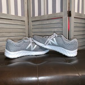 Grey and white new balance running shoes